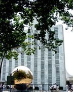 golden ball in front of un tower